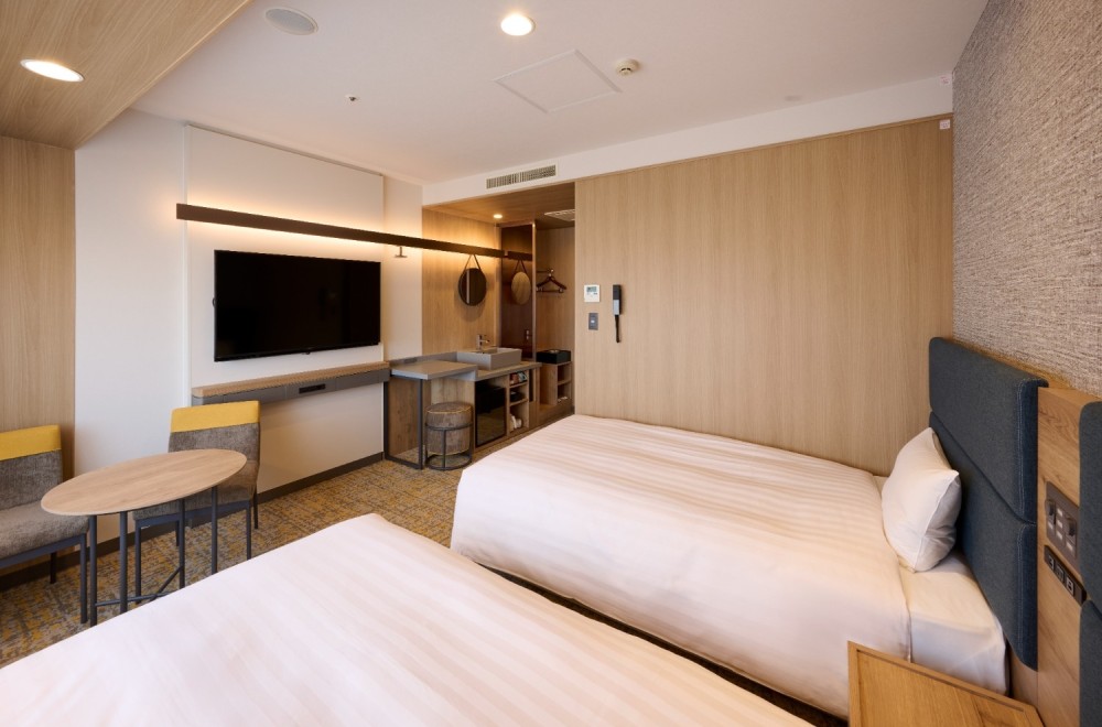 Bed and Amenities in a Twin Room at Via Inn Shinagawa-Oimachi