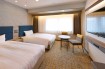 Bed and Desk Chair in a Twin Room at Via Inn Shinagawa-Oimachi